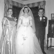 100 018 10 Mom in wedding dress with her parents